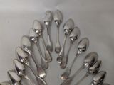 a lot of silver spoons arranged in a circle