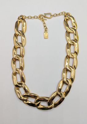 a gold chain necklace with a lock on a white background