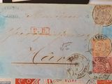 a piece of paper with stamps on it sitting on a table