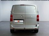 a silver van that is parked in a garage