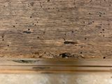 a close up of a piece of wood with holes in it
