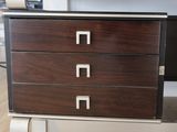 a picture of a dresser with three drawers on it