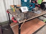 a table with a number 30 on it with tools on it