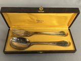 an image of a set of silverware in a box
