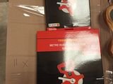 two boxes with a pair of scissors and a box with a pair of scissors