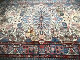 an image of a large oriental rug on a wooden floor