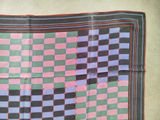 an image of a square scarf with a checkerboard pattern