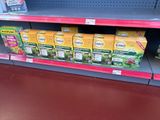many boxes of tea on the shelf in the store