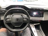 someone is sitting in the driver ' s seat of a car with their feet on the steering wheel