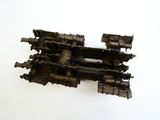 a small model of a train on a white surface