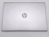 hp laptop computer sitting on a white surface with a logo on it