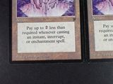 two cards that are sitting on a table