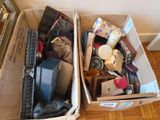 two boxes that have various items in them on the floor