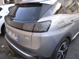 a silver car parked on the side of the street