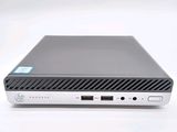a close up of a small computer on a white surface
