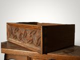 a wooden box sitting on top of a wooden table