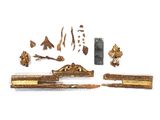 a close up of a piece of wood with a knife and other items
