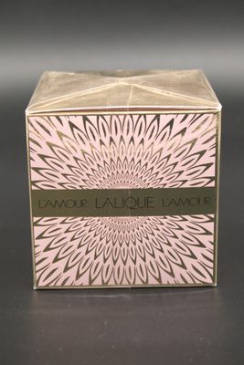 a close up of a box of perfume on a table