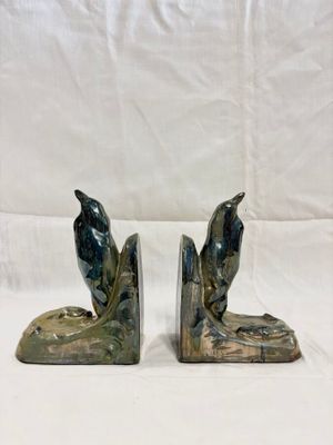 a pair of bookends with two birds on them