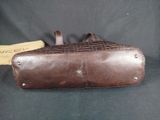 brown leather case with rivets and rivets on it