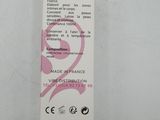 the back of a white box with a pink sticker on it