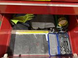 a red tool box with tools inside of it
