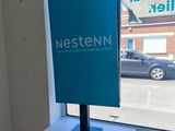 a blue sign on a window sill in a room