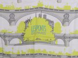a yellow and white scarf with a picture of a bridge in the background