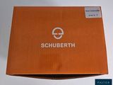 an orange box with a white logo on it sitting on a table