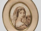une photo ancienne représentant une femme avec un chat sur les genoux