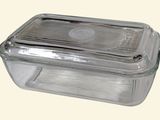 a clear glass container with a lid on a white background