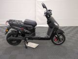 a scooter that is parked on a checkered floor