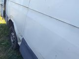 a white van that is parked in the grass
