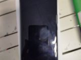 a cell phone that is in a box on a table