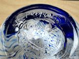a glass bowl with a blue and white design on it