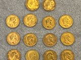 a pile of gold coins sitting on top of a blue towel