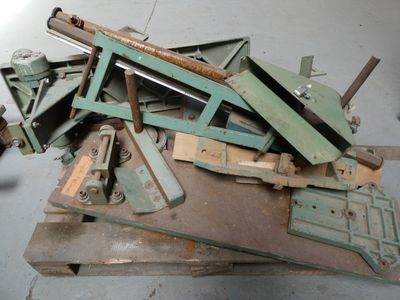 a pile of old metal tools sitting on a table