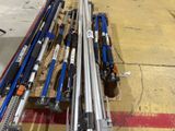 a lot of skis and poles on the ground