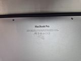 a close up of the back of a macbook pro