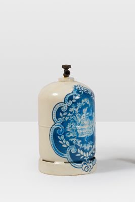 pair of blue and white vases sitting on top of a white table