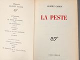 an open book with a black and red title on it
