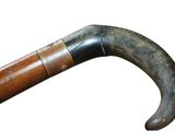 a close up of an old cane with a wooden handle