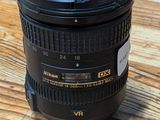 a close up of a camera lens on a wooden table