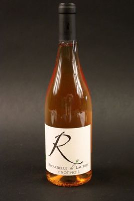 a bottle of wine that is sitting on a table