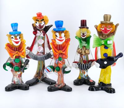 five figurines of clowns with guitars and hats