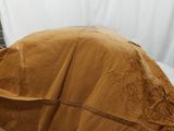 a large rock that is covered with a sheet of paper