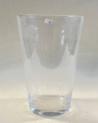 a clear glass vase sitting on a white table