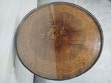a wooden table with a floral design on it