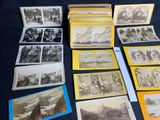 a lot of old photos on the table together