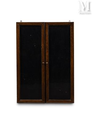 pair of antique wooden doors with black glass panels